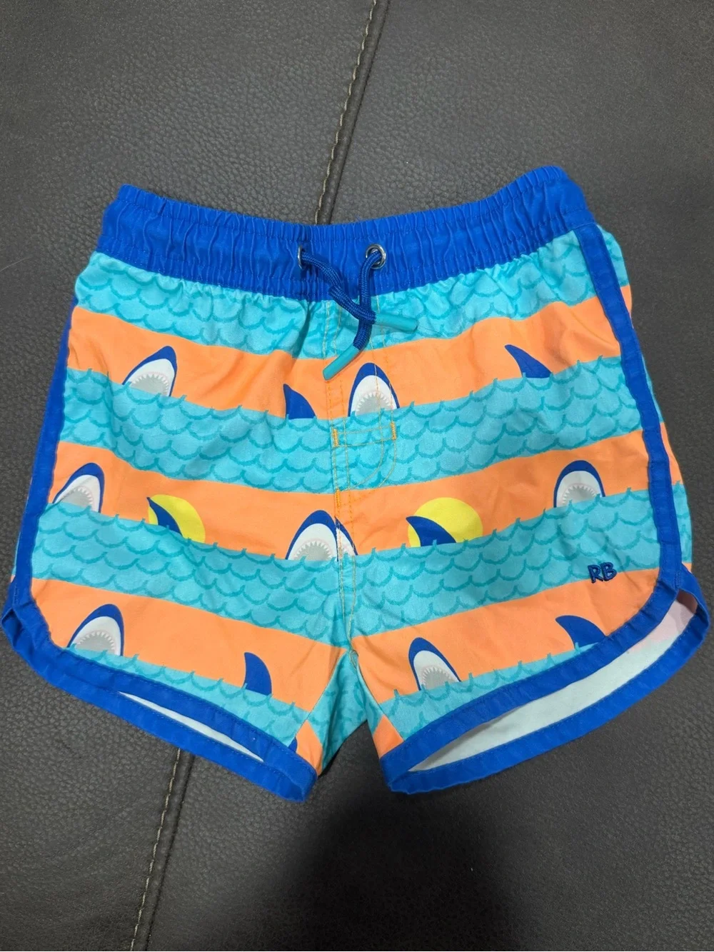 Boys Blue & Orange Shark Stripe Swim Trunks